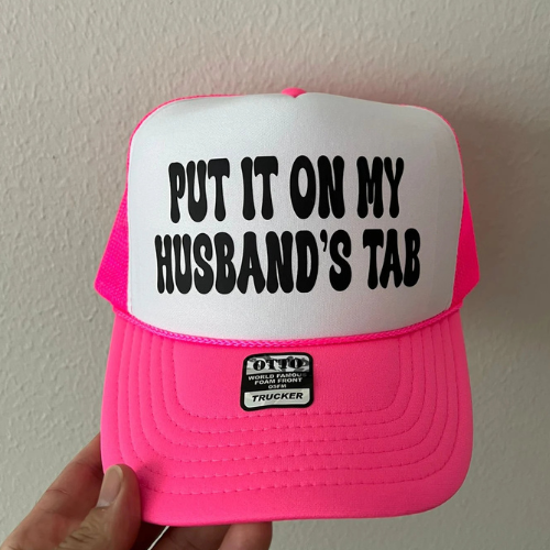 Put It On My Husbands Tab Trucker Hat